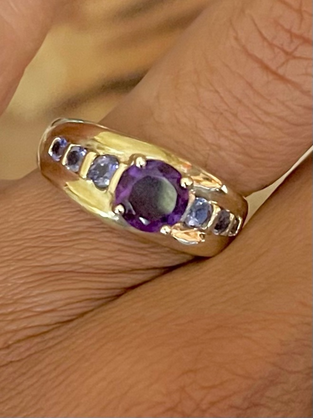Gold Band Ring with Purple Center Gem and Purple Accent Stones